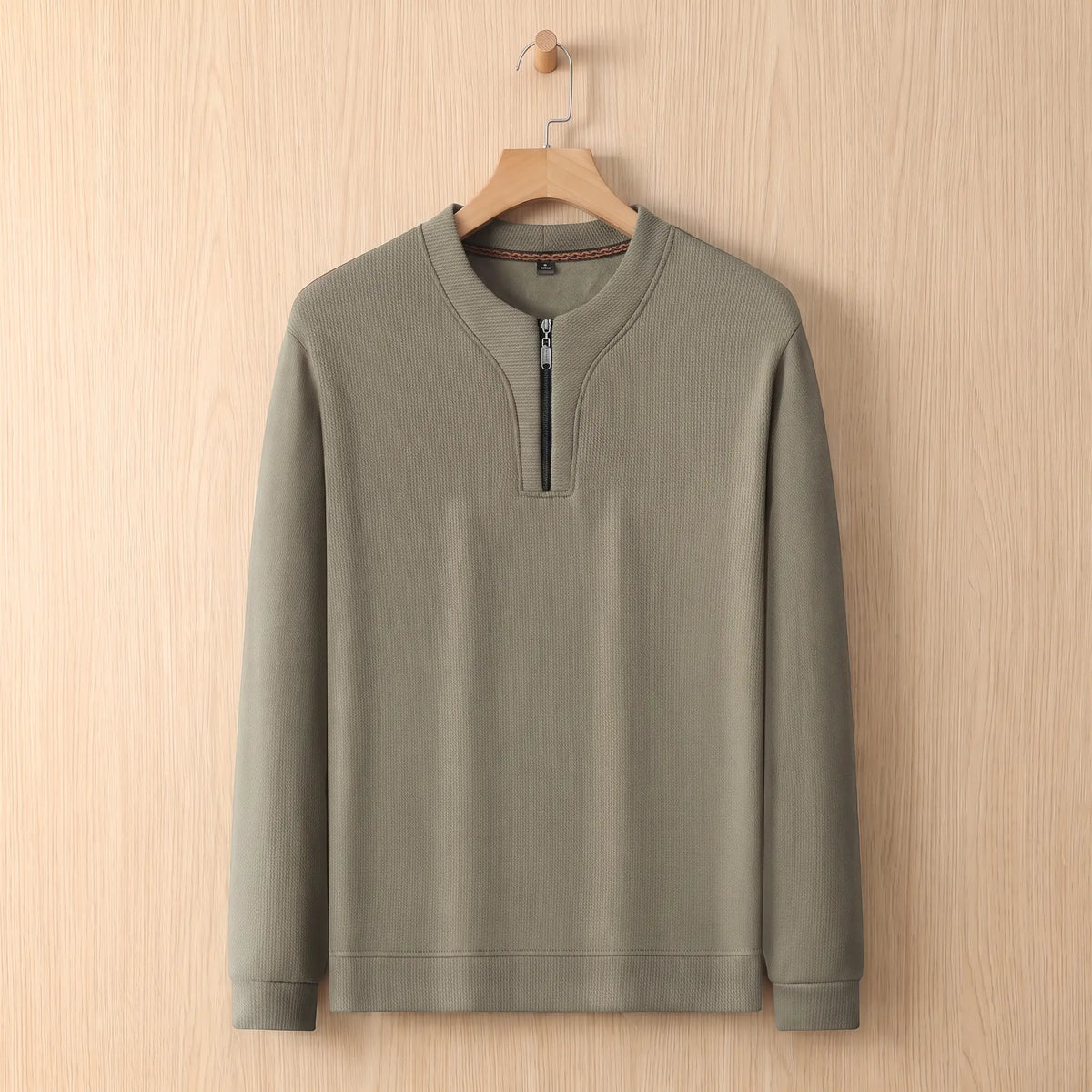 Notch Neck Pullover in green on a wooden hanger, men's textured half-zip sweater