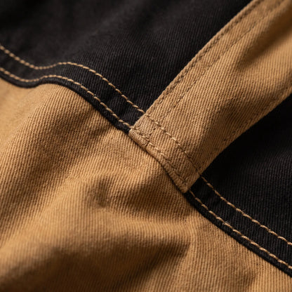Macro of the cotton twill weave and contrast panel topstitching on the panel cargo trousers
