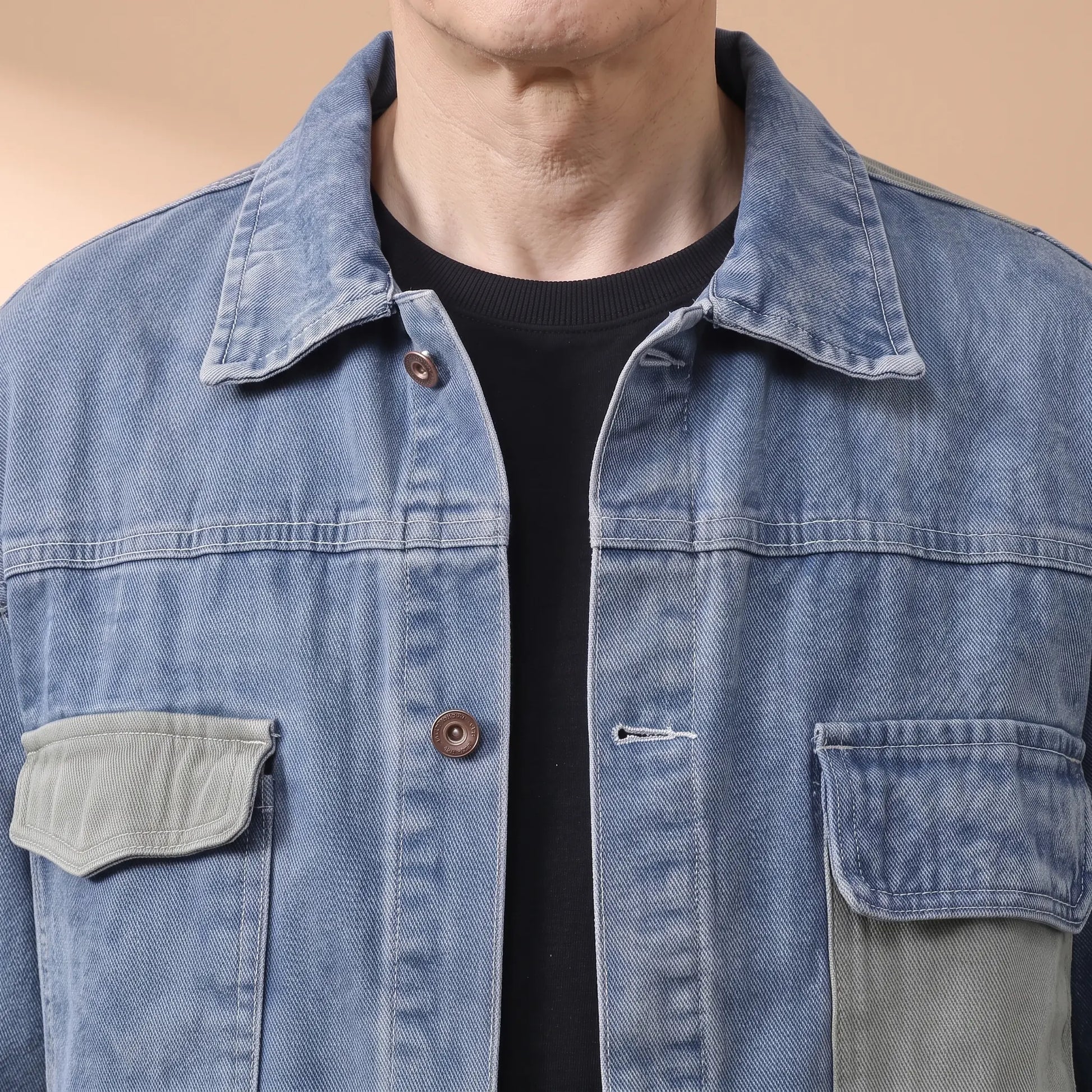 Close-up of the denim jacket collar, copper shank buttons and sage flap chest pocket
