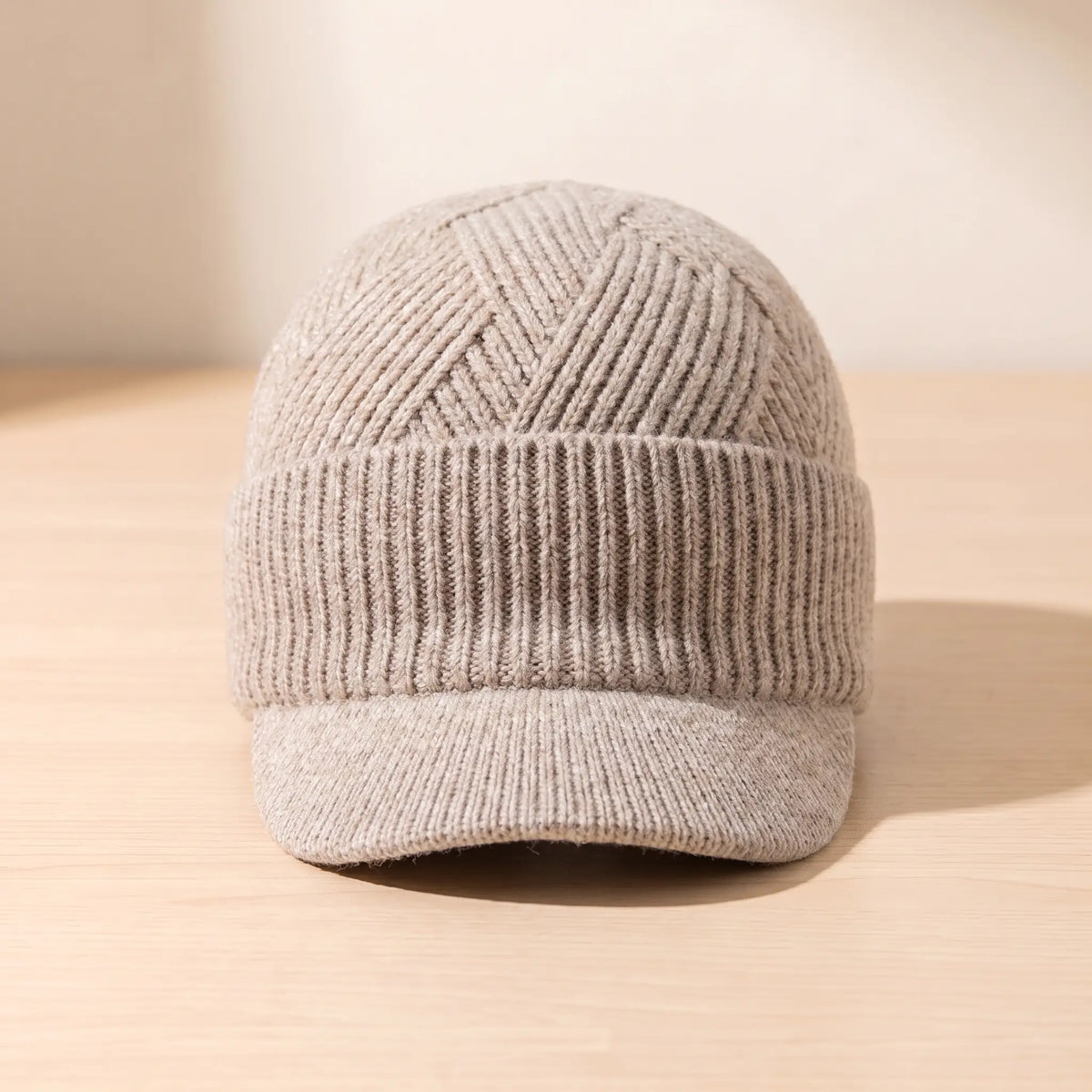 Men's beige peaked knit beanie with chevron ribbed crown and folded cuff