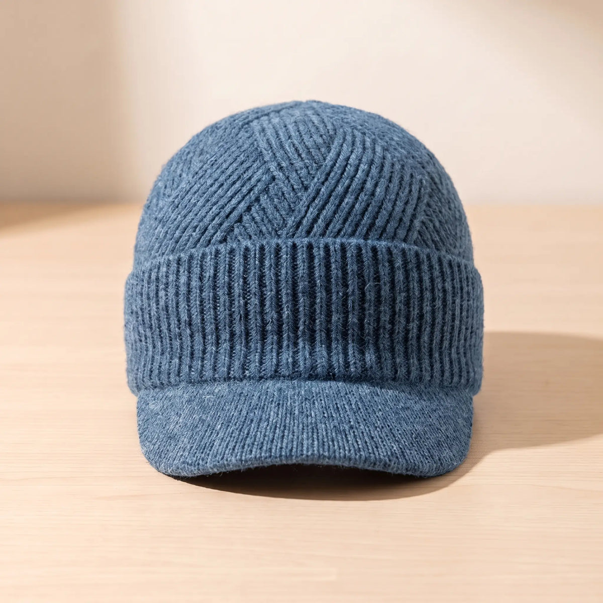 Men's blue peaked knit beanie with chevron ribbed crown and folded cuff
