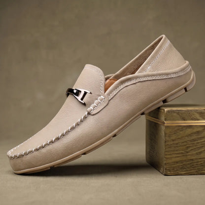 Beige pebbled leather slip on driving loafer for men with silver metal bar and ivory contrast stitching