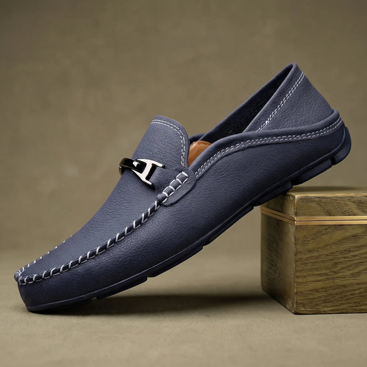 Blue pebbled leather slip on driving loafer for men with silver metal bar and ivory contrast stitching