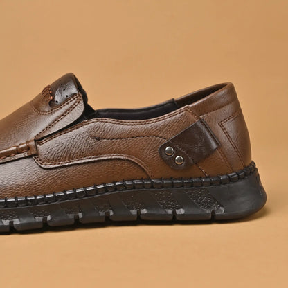 Pebble Moc Loafers in Brown, riveted heel tab and chunky sole close-up
