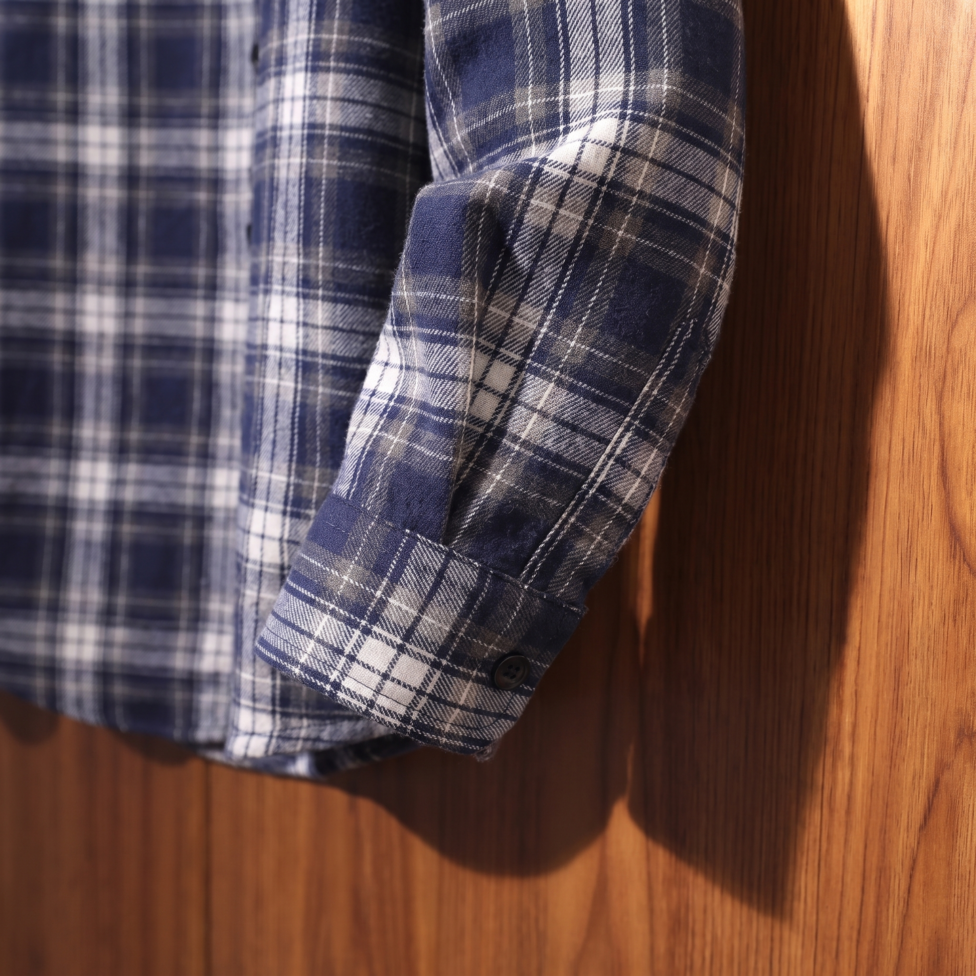 Plaid flannel shacket cuff and sleeve detail