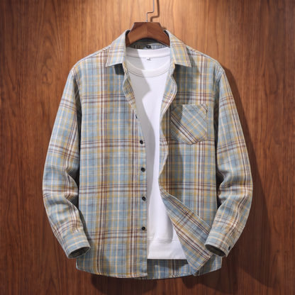 Light blue plaid flannel shacket on a wooden hanger