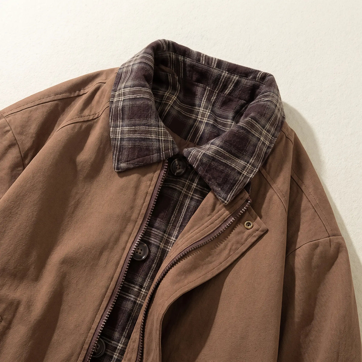 Close up of the PLAID PLACKET JACKET plaid collar and button placket