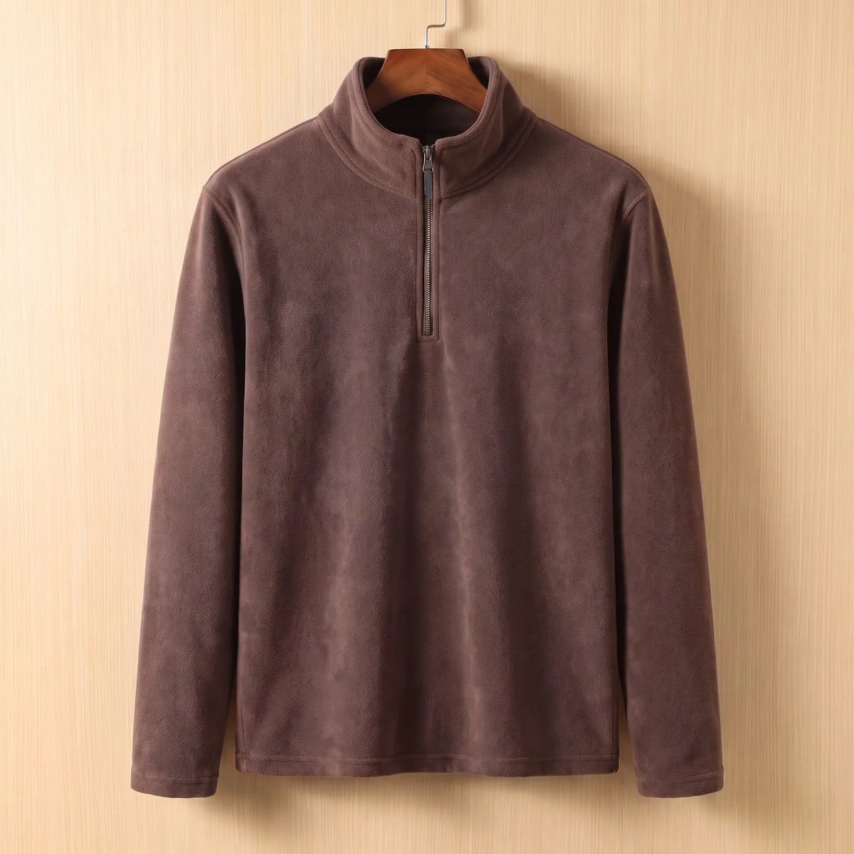 PLAIN FLEECE PULLOVER in Brown - fleece quarter-zip pullover with tall stand collar, on a wooden hanger