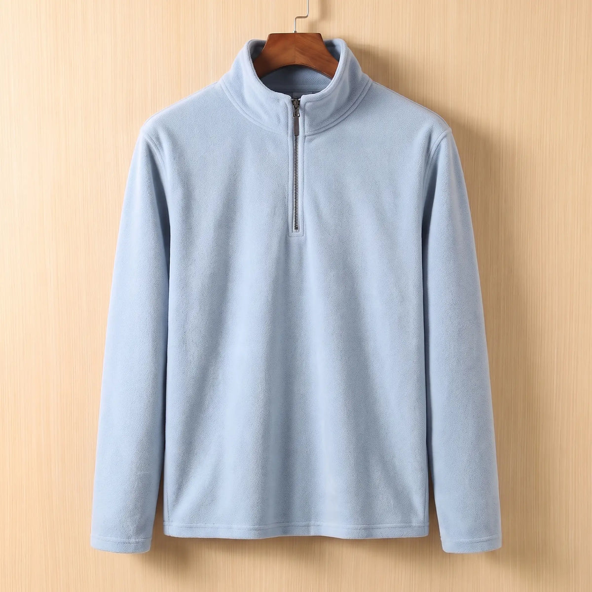 PLAIN FLEECE PULLOVER in Light Blue - fleece quarter-zip pullover with tall stand collar, on a wooden hanger