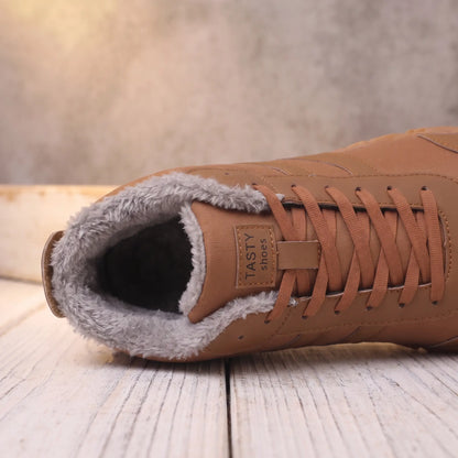 Close-up of the plush fleece collar and laces on the brown winter boot