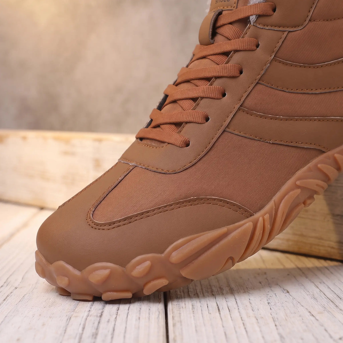 Close-up of the roomy toe and deep gum tread sole on the brown winter boot