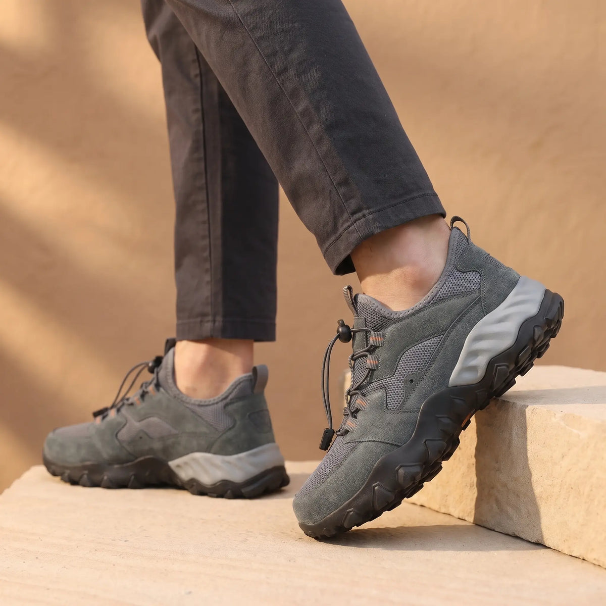 Quick Lace Sneakers in Grey, worn with dark trousers