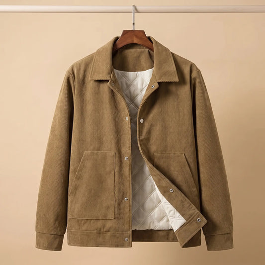 Khaki quilted corduroy jacket on a wooden hanger showing the cream quilted lining