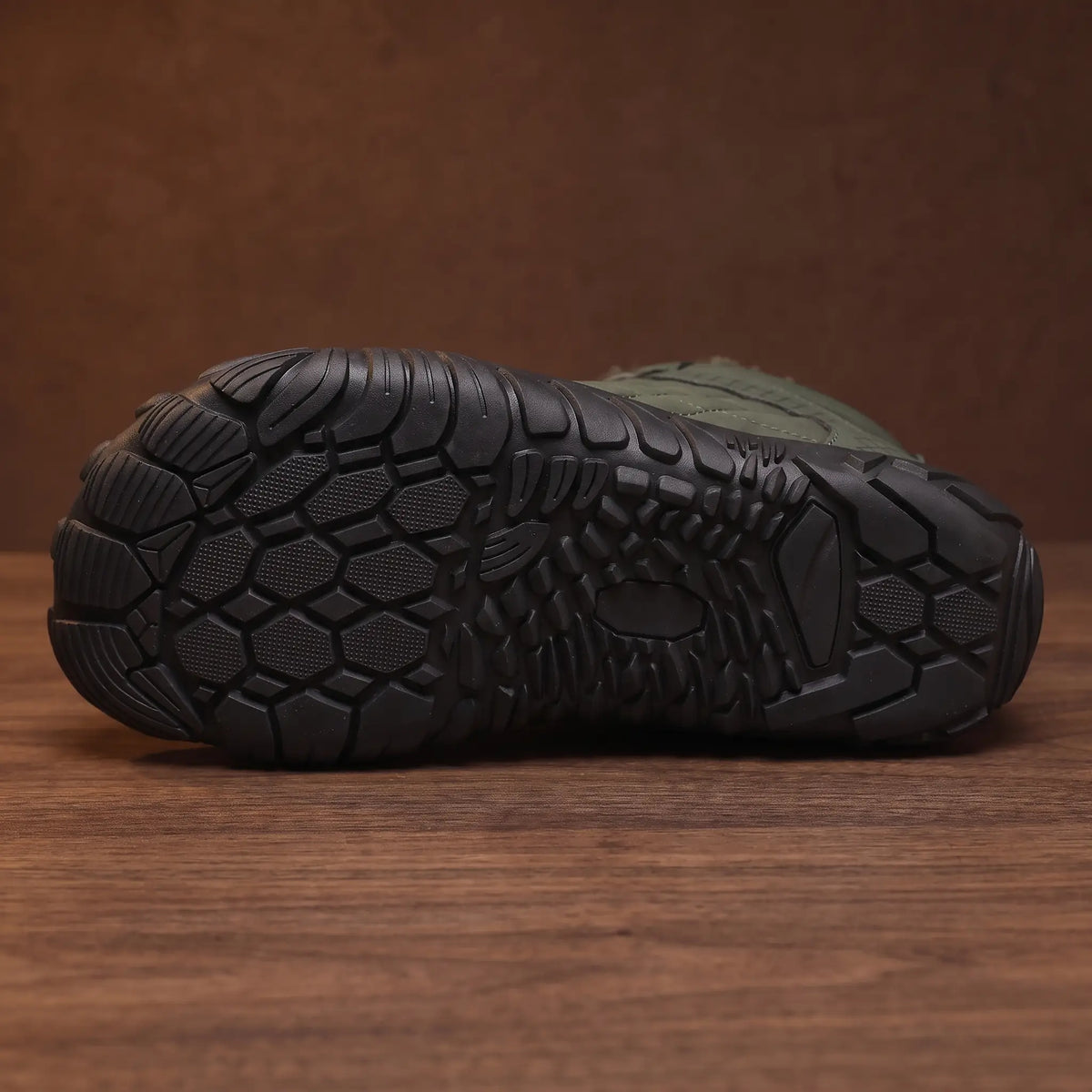 Close-up of the flexible tread sole of the quilted snow boot