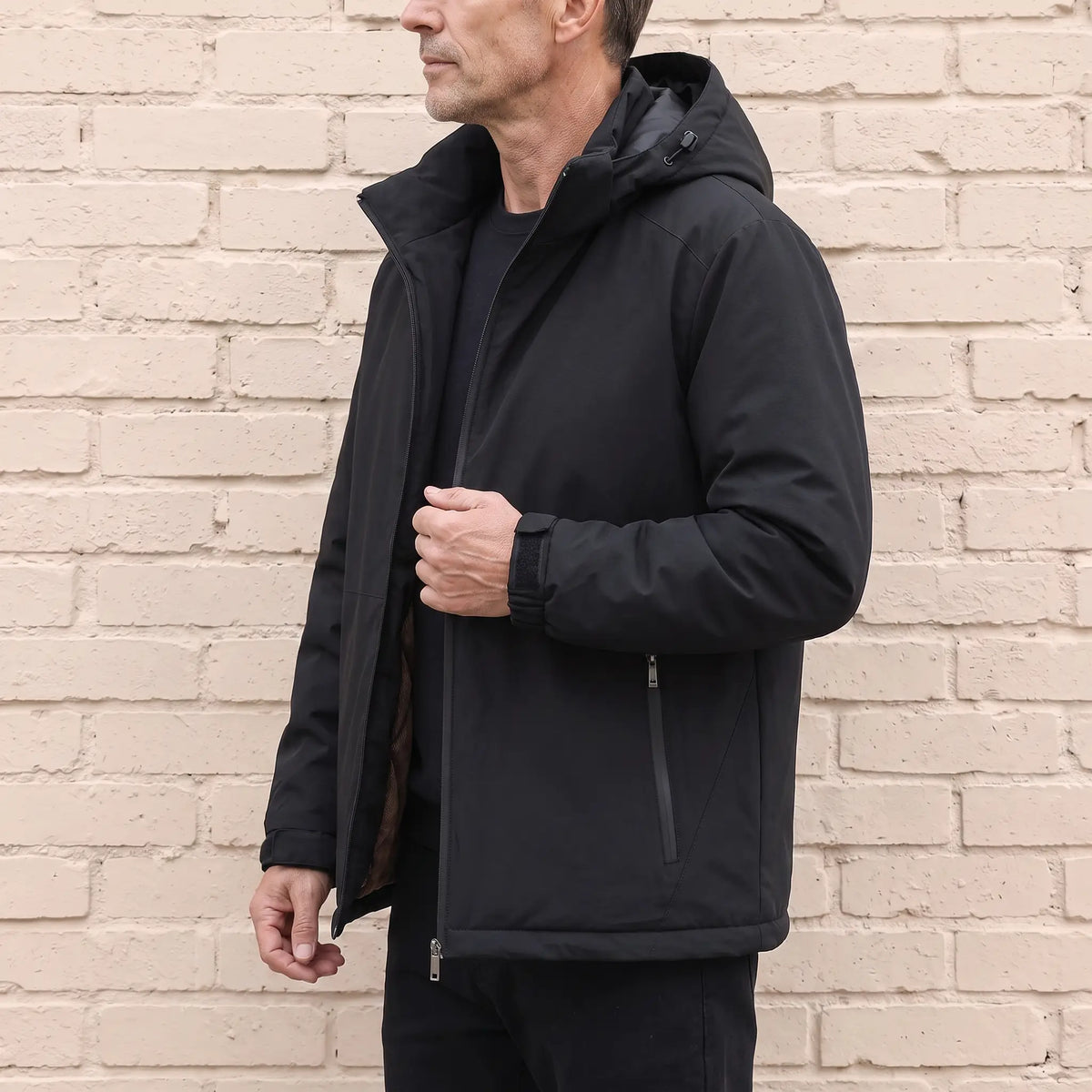 Quilt Lined Jacket in Black worn, side view zipping up