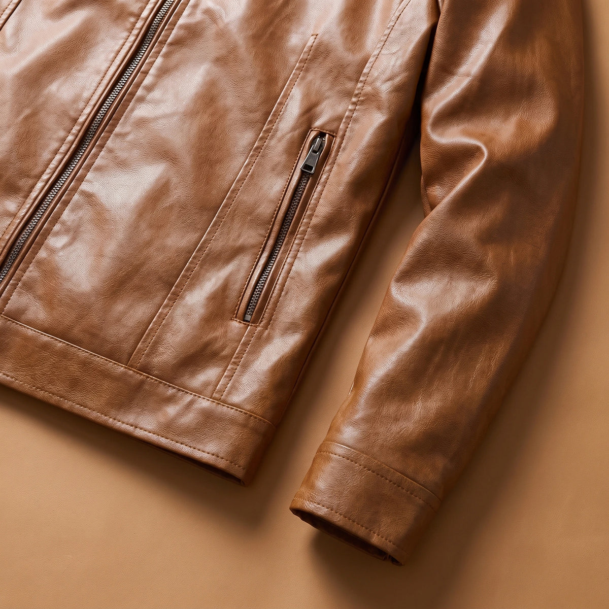 Close view of the cuff, hem and zip hand pocket