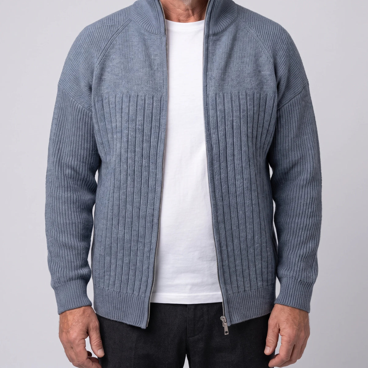 Grey men's ribbed knit zip cardigan with tall stand collar and raglan sleeves, worn open