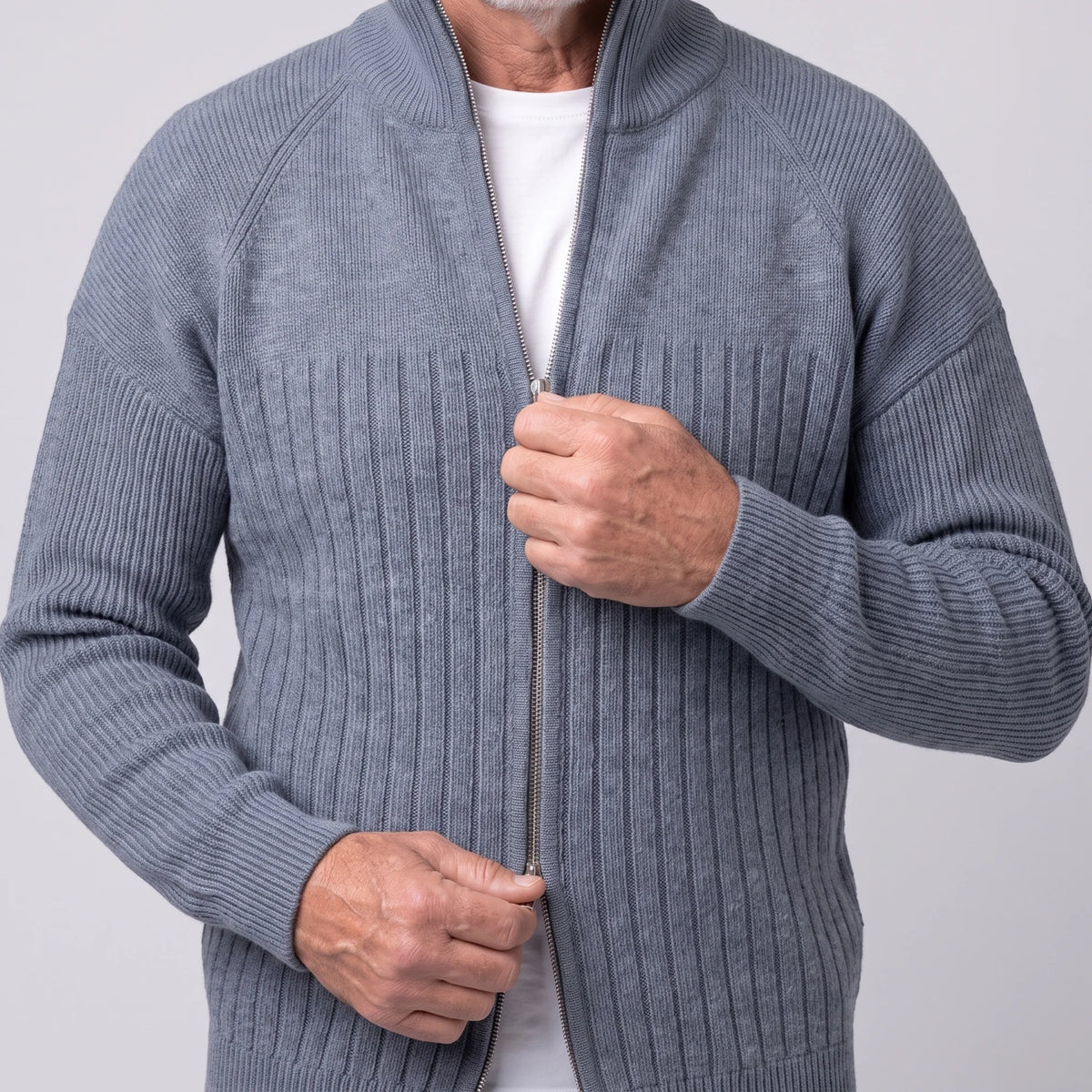 Man zipping up the grey raglan rib cardigan over a white tee