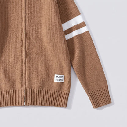 Close-up of the brown Raglan Zip Cardigan showing the sleeve stripes, ribbed cuff and hem