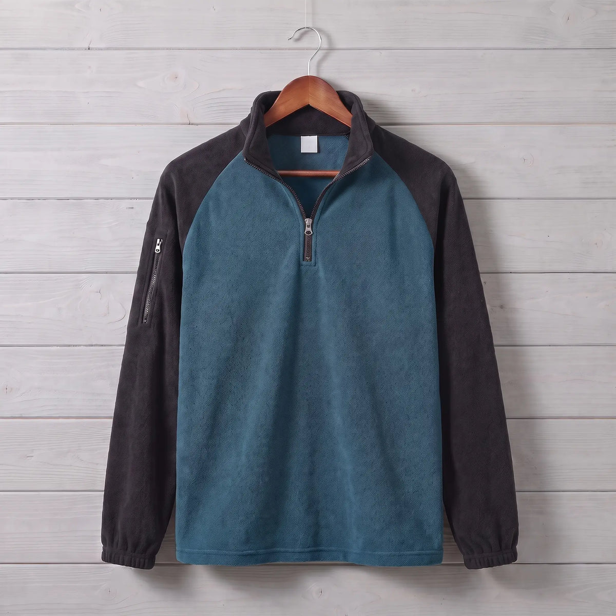 RAGLAN ZIP FLEECE in blue, teal blue men's brushed fleece quarter-zip pullover with contrast raglan sleeves in black