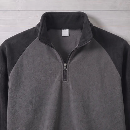 Close up of the RAGLAN ZIP FLEECE stand collar, quarter zip and raglan seams