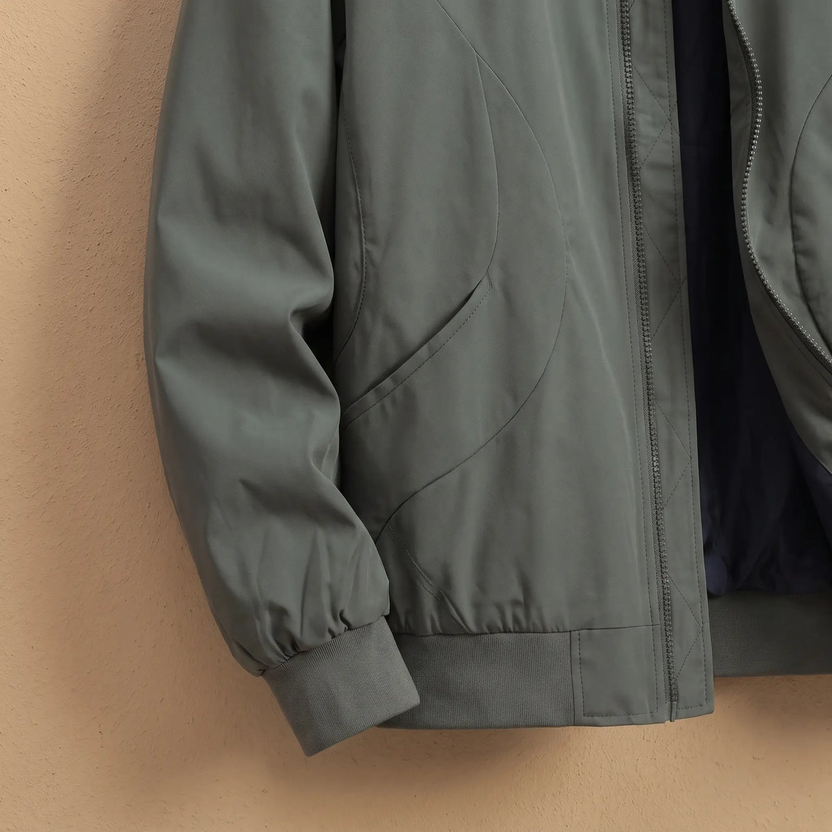Relaxed Fit Bomber in Green, cuff and hem close-up