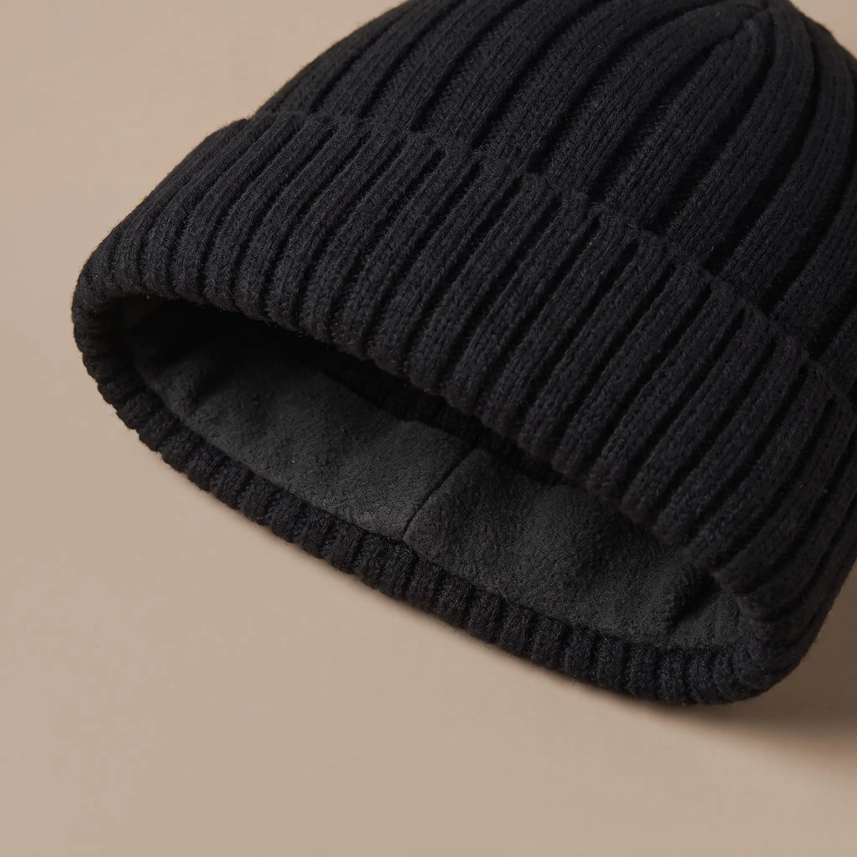 Fleece band shown inside the cuff of the ribbed docker beanie