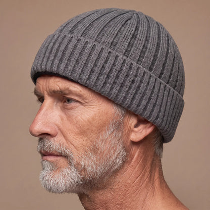 Ribbed docker beanie in grey worn side profile by an older man