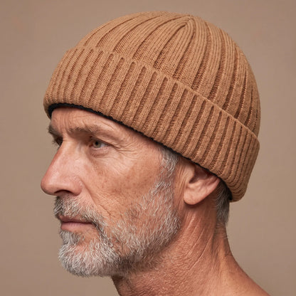 Ribbed docker beanie in khaki worn side profile by an older man
