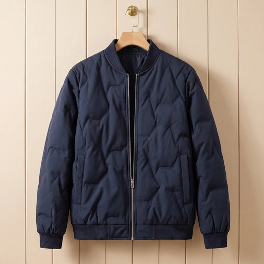 Ridgeline quilted bomber in navy blue on a wooden hanger
