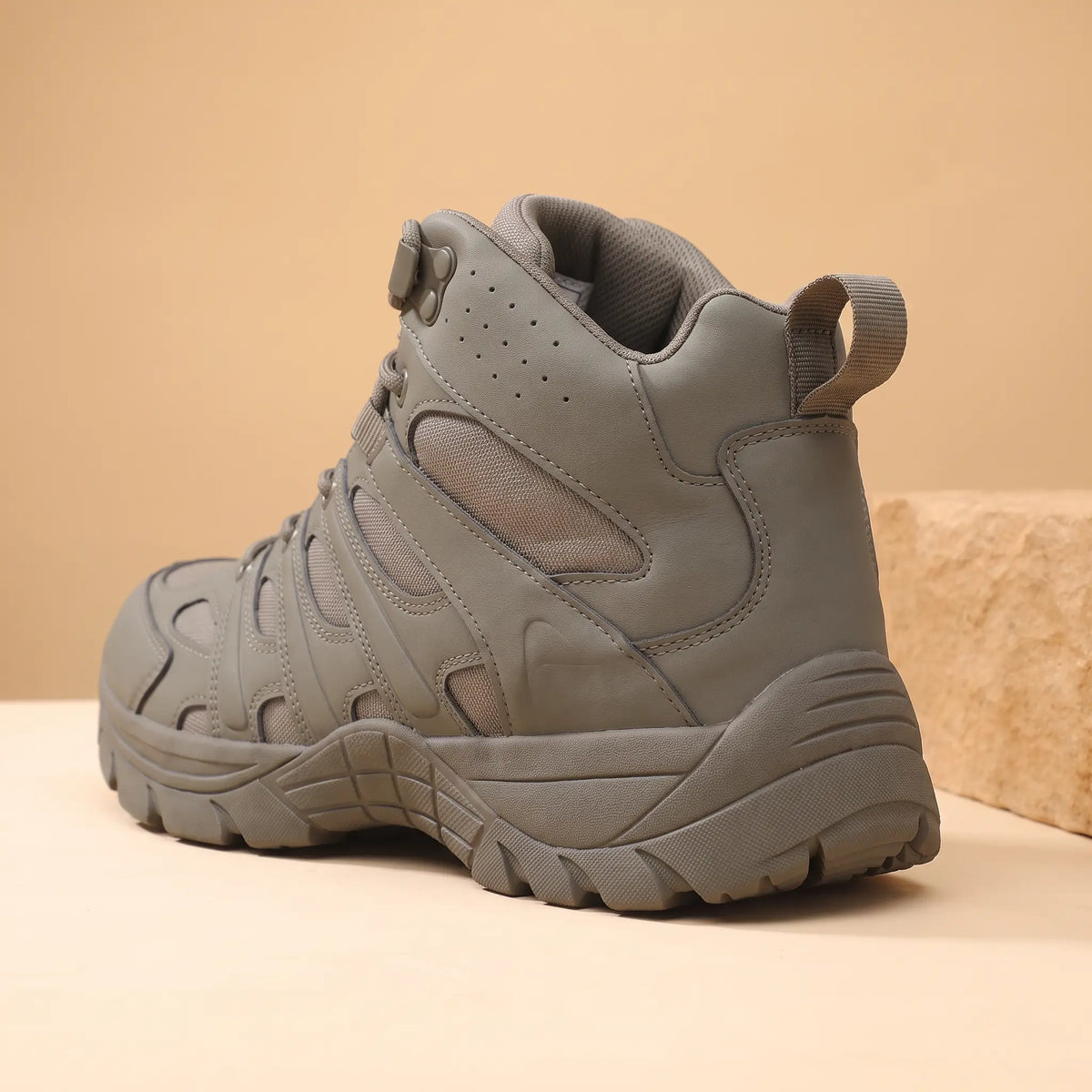 Rocky Ground Boots in Green, heel tab and cleated sole close-up