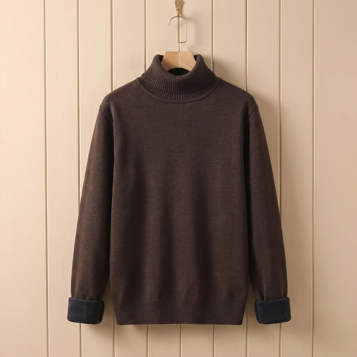 Men's brown fleece lined roll neck sweater on a wooden hanger