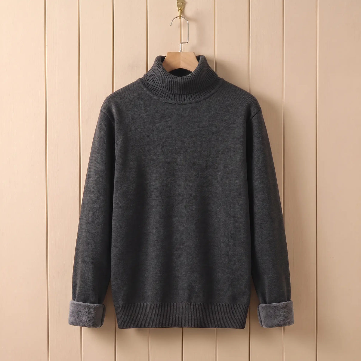 Men's dark grey fleece lined roll neck sweater on a wooden hanger