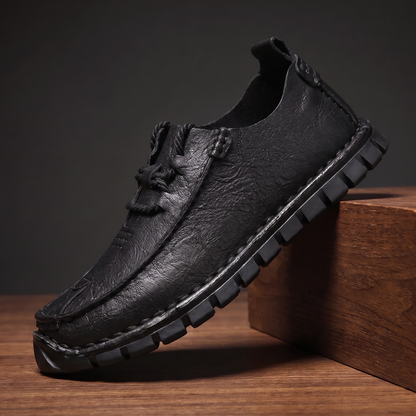 Black pebble grain leather moccasin with rope lace and lugged sole