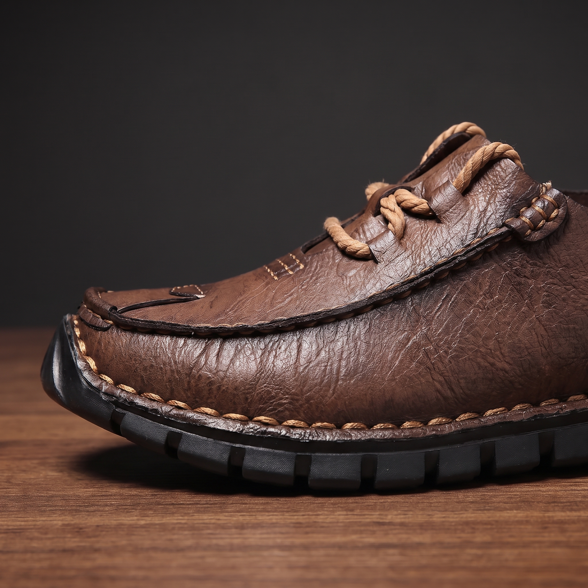 Close-up of the moccasin vamp, rope lace knot and hand stitching
