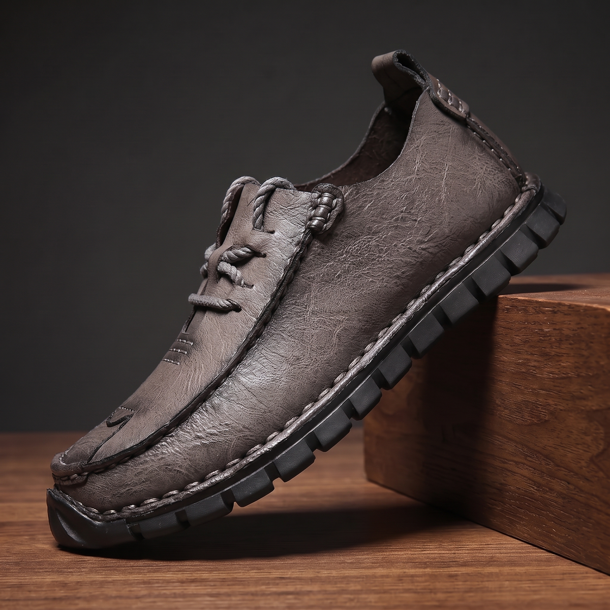 Grey pebble grain leather moccasin with rope lace and lugged sole