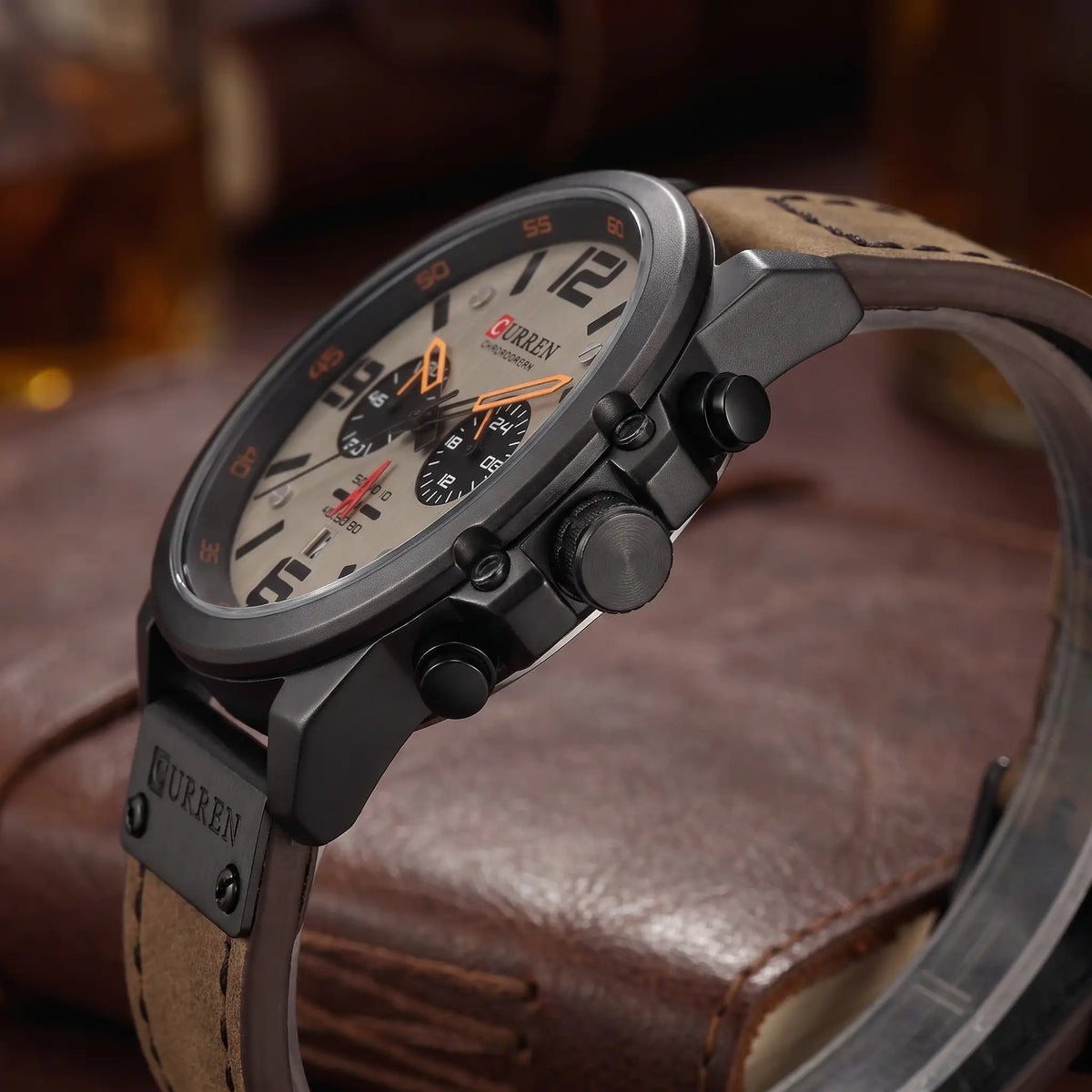 Side view of the crown and stopwatch pushers on the black chronograph