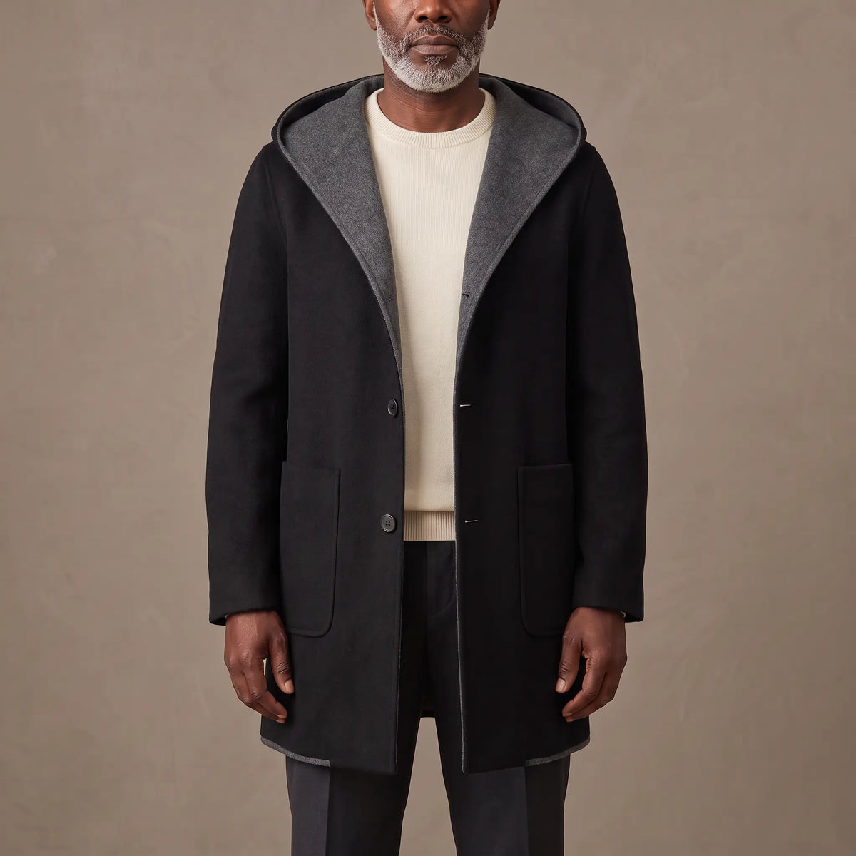 SHAWL HOOD COAT in black, mid length hooded overcoat with contrast grey hood facing, worn