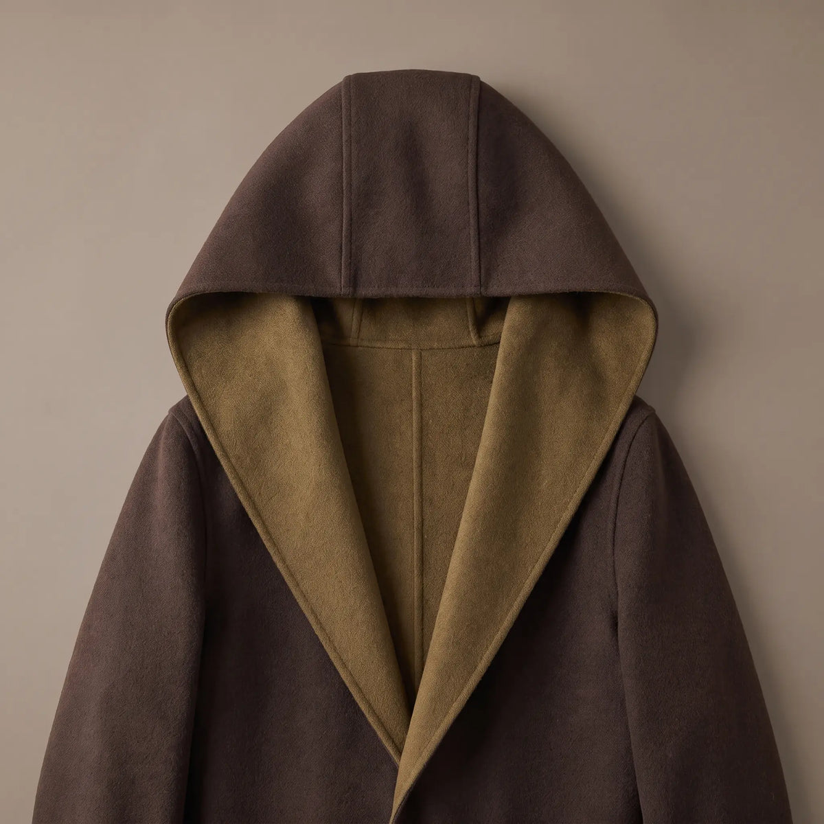 Close up of the SHAWL HOOD COAT hood and shawl lapel showing the contrast facing inside