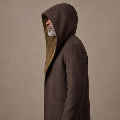 Man in side profile wearing the SHAWL HOOD COAT with the hood pulled up