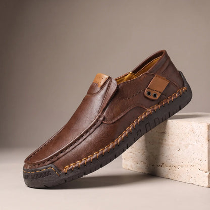 Dark brown side tab leather loafers with hand stitched welt and rubber driving sole