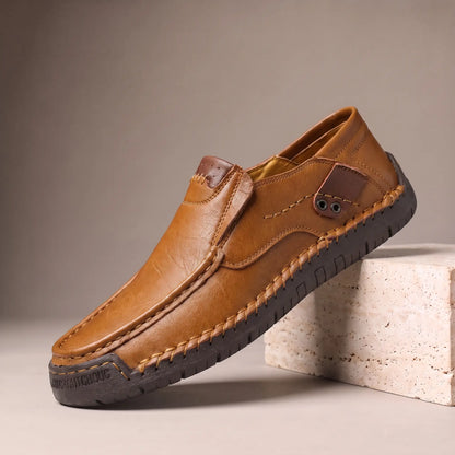 Light brown side tab leather loafers with hand stitched welt and rubber driving sole