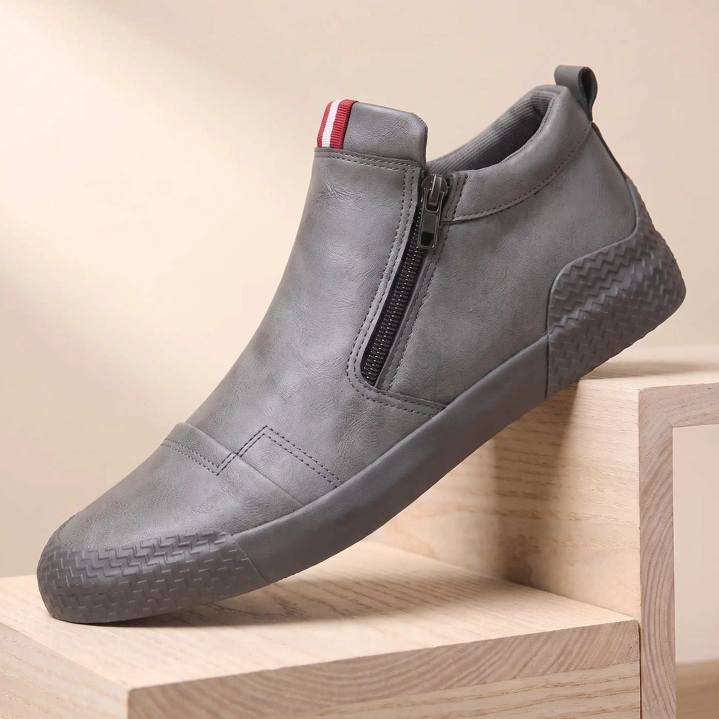 Grey leather side zip high top slip on shoes with rubber toe guard