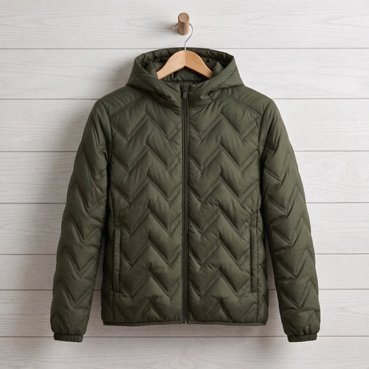 Skyline quilted jacket in green on a wooden hanger