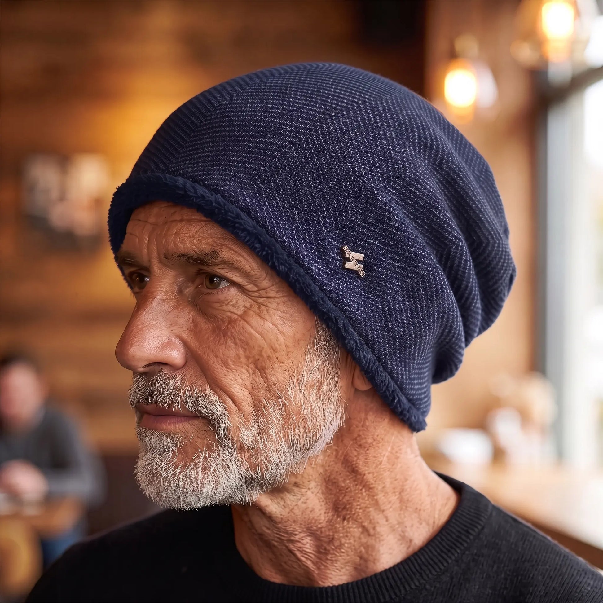 Older man wearing the navy fleece lined slouch knit beanie in side profile