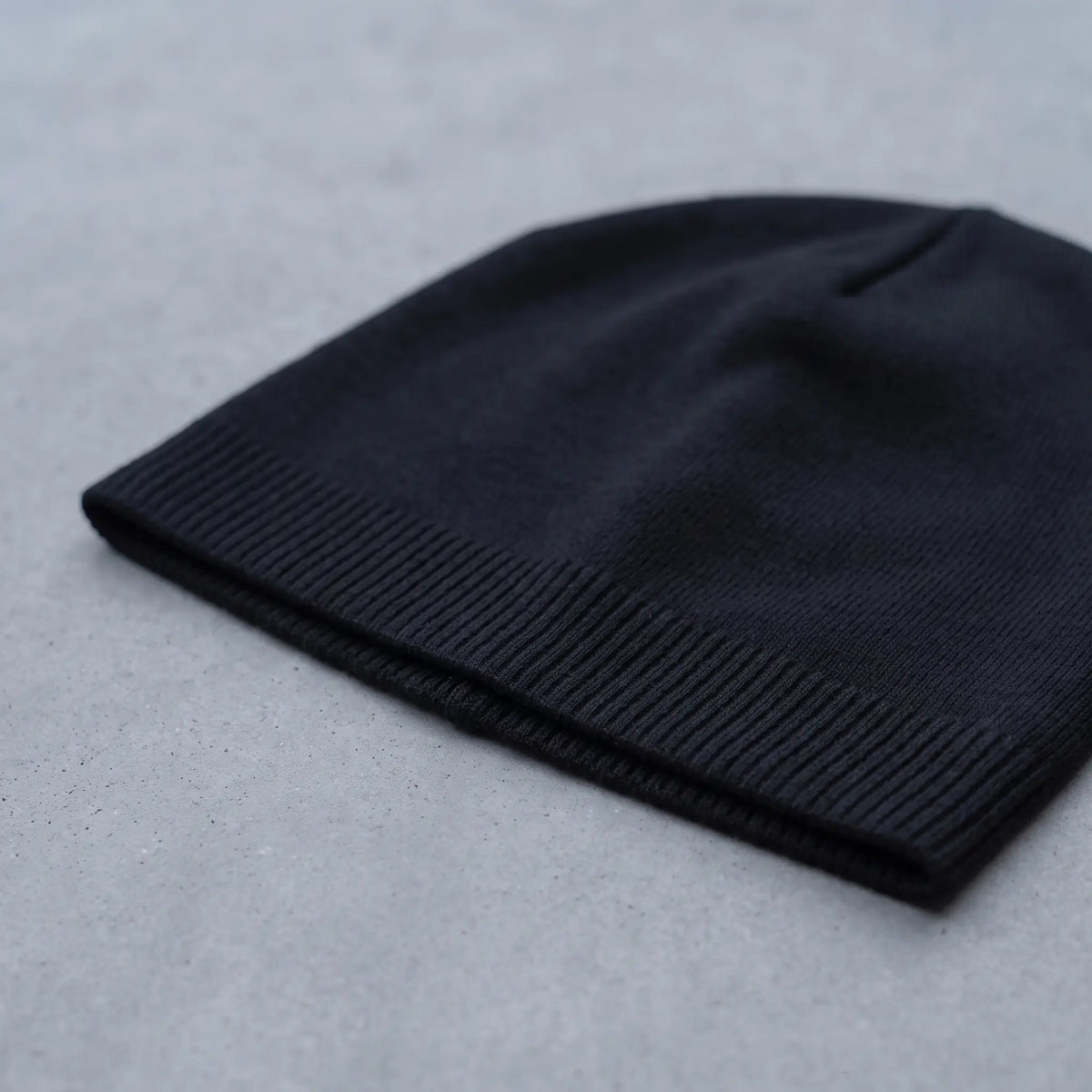 Close up of the ribbed hem on the smooth knit beanie