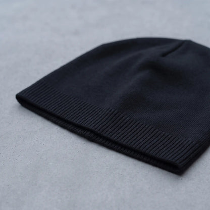 Close up of the ribbed hem on the smooth knit beanie