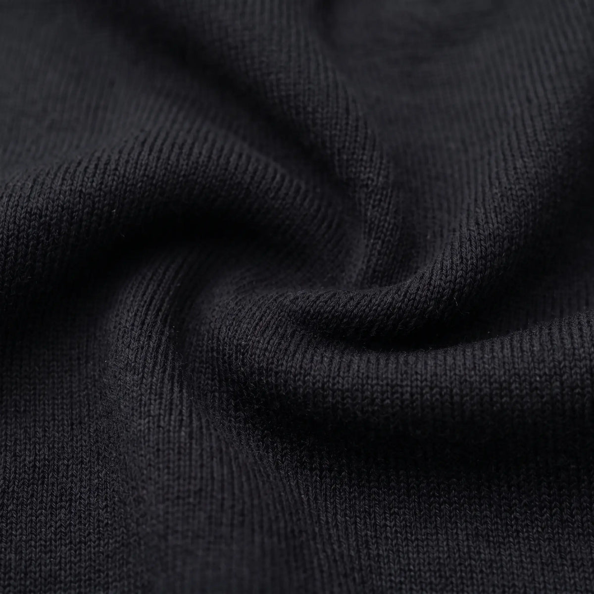 Close up of the flat knit texture on the smooth knit beanie