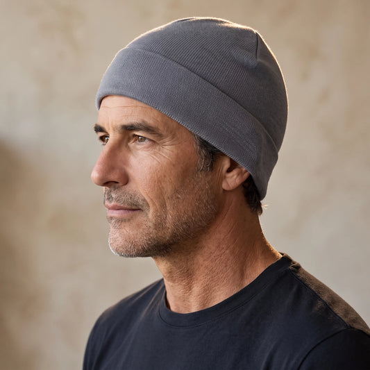 Smooth knit beanie in grey, close fit pulled down over the ears, men's winter beanie shown in side profile