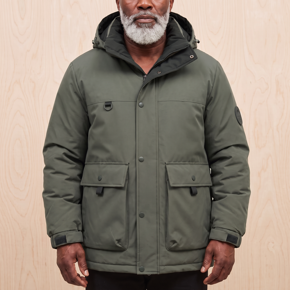 Men's green hooded padded parka with snap storm front